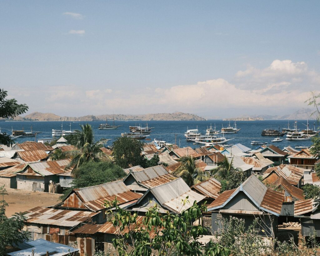 A group of boats floating on top of a body of water