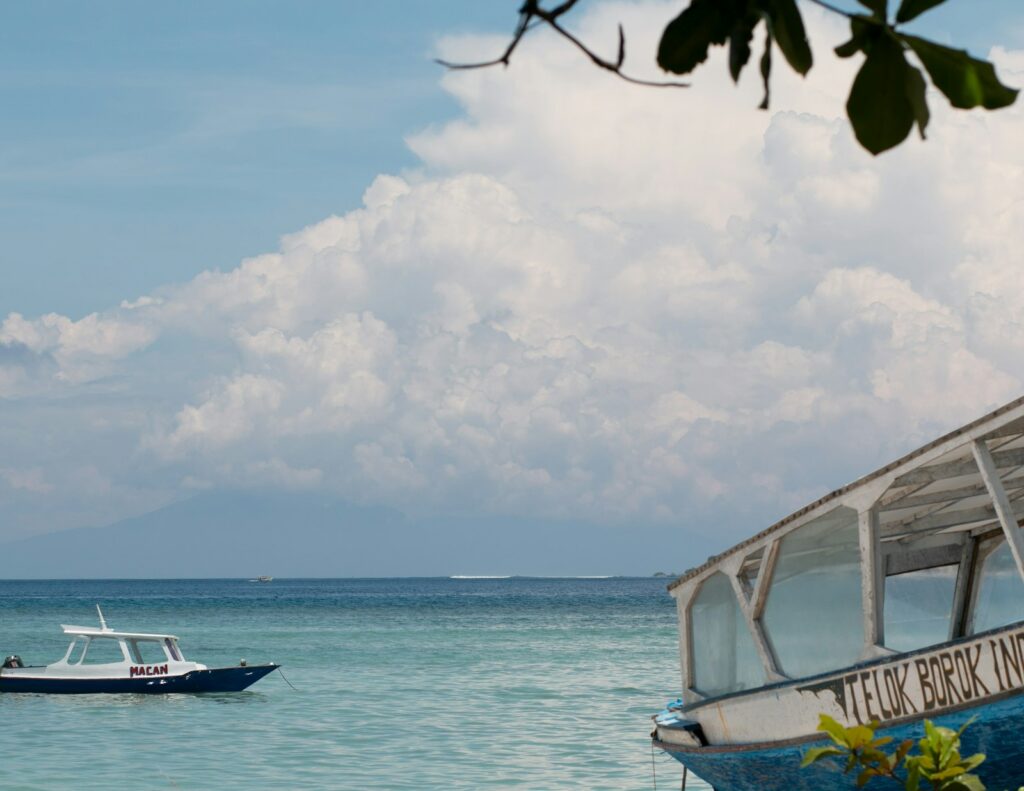 A boat floating on top of a large body of water